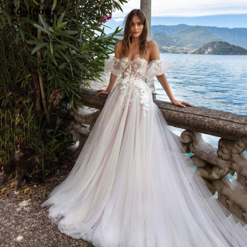 Toofgon Chic Lace Appliques Boho Wedding Dresses Bride Short Puffy Sleeves Princess Long Train Bridal Gowns Sexy Robe De Mariee
Toofgon Chic Lace Appliques Boho Wedding Dresses Bride Short Puffy Sleeves Princess Long Train Bridal Gowns Sexy Robe De Mariee