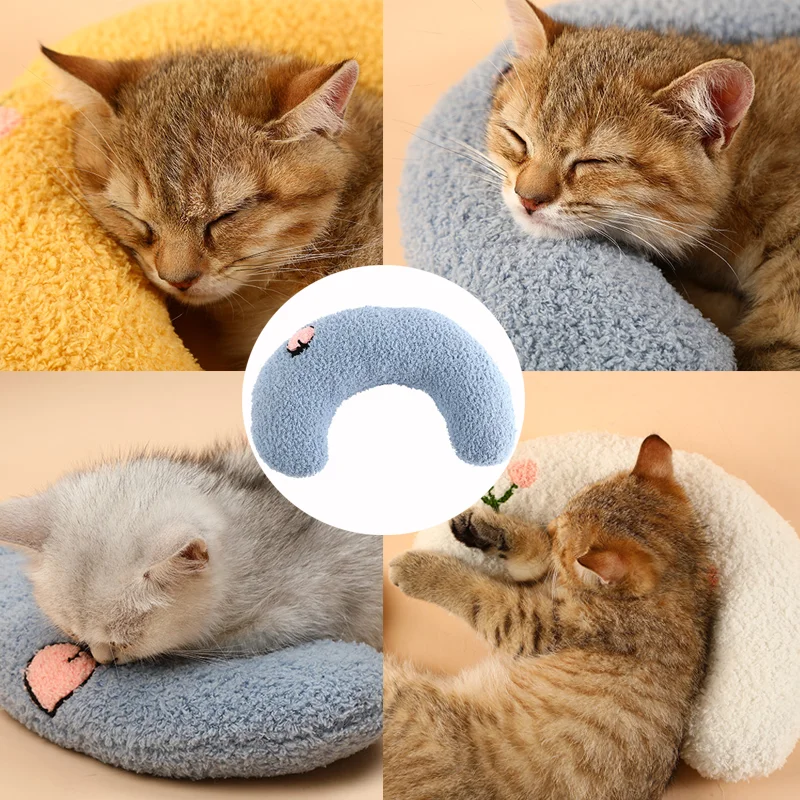 Four images of cats sleeping on soft, donut-shaped pet beds highlight the calming and anxious relief provided by these cozy spots. The main image showcases the Cozy Pet Pillow for Cats and Small Dogs by The Stuff Box in various colors, each featuring a little pillow for cats to rest their heads on.