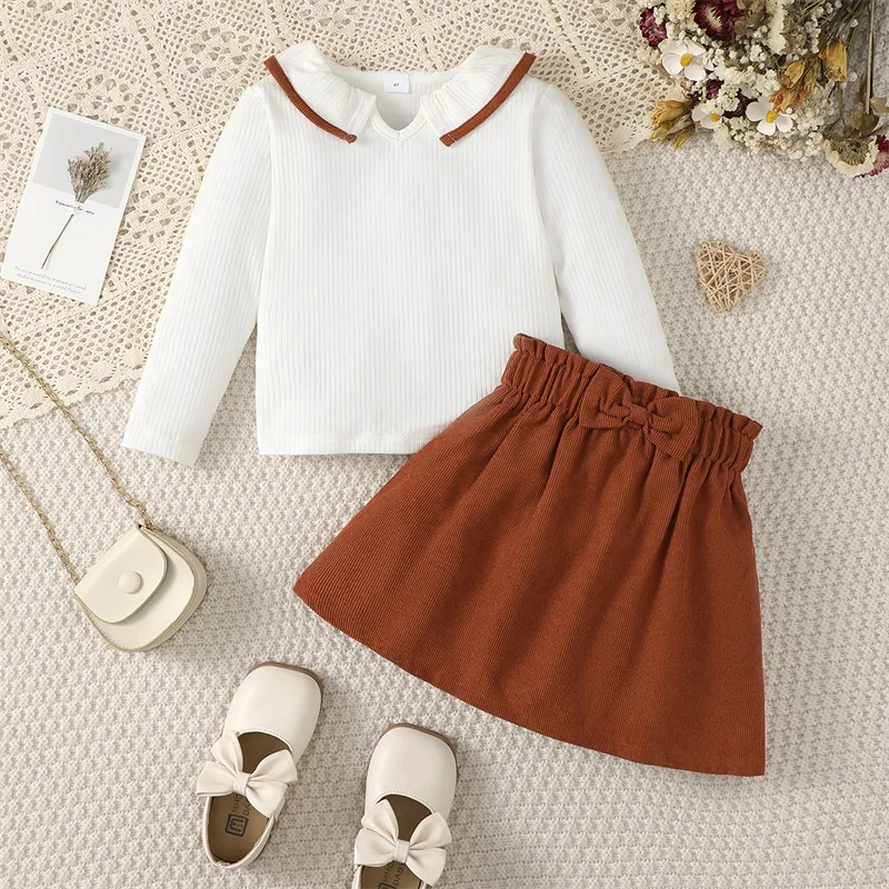 Kids Girls Fall Outfits Ruffles Doll Collar Ribbed Long Sleeve T-Shirts Tops Elastic Waist A-line Skirts 2Pcs Clothes Set
Kids Girls Fall Outfits Ruffles Doll Collar Ribbed Long Sleeve T-Shirts Tops Elastic Waist A-line Skirts 2Pcs Clothes Set