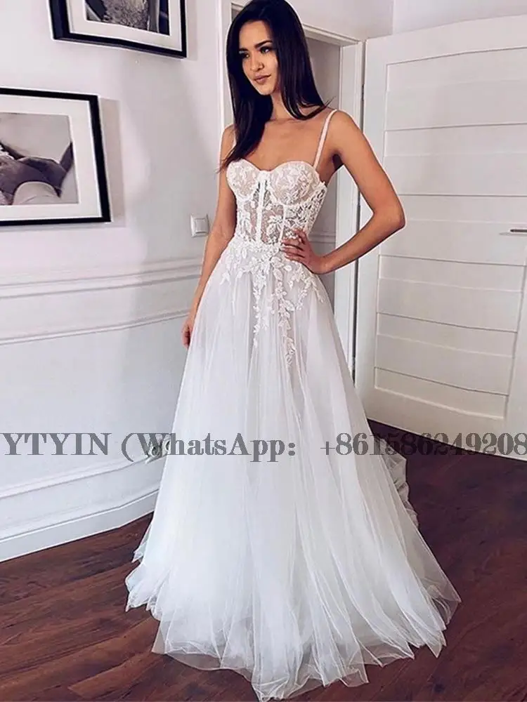 Applique Illusion Boho Wedding Dress Spaghetti Strap Soft Tulle Beach Bridal Gowns Floor Length Robe De Soirée De Mariage
Applique Illusion Boho Wedding Dress Spaghetti Strap Soft Tulle Beach Bridal Gowns Floor Length Robe De Soirée De Mariage