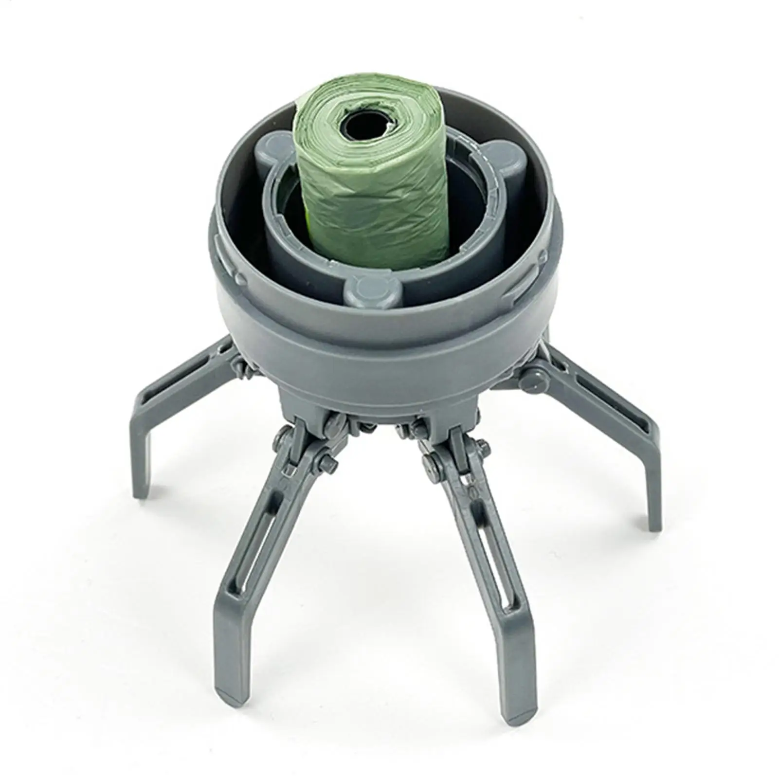 Dog Poop Scooper | Dog Waste Picker A top-down view of the grey mechanical base of the scooper. The six claws are extended outward, and a roll of green waste bags is seated in the center of the device.