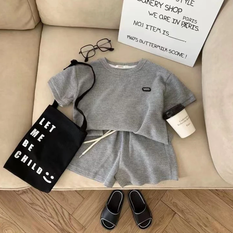 Korean Summer Fashion Children's Casual Waffle Short Sleeve Two Piece Set for Kids Boys Girls Casual Set Unisex Baby Boy Clothes
Korean Summer Fashion Children's Casual Waffle Short Sleeve Two Piece Set for Kids Boys Girls Casual Set Unisex Baby Boy Clothes