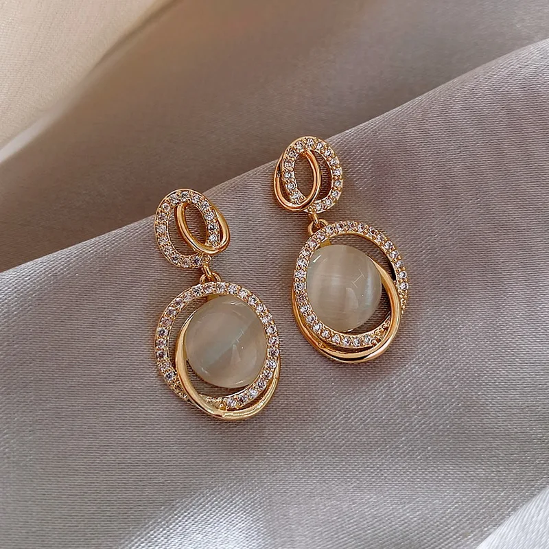 Korea New White Moonlight Cat's Eye Stone Earrings For Women Small Fresh Geometric Eardrop Elegant Ladies Temperament Jewelry 5 Mallzona Sf74e04ff51594f8e8223960b953c7ac5G Korea New White Moonlight Cat's Eye Stone Earrings For Women Small Fresh Geometric Eardrop Elegant Ladies Temperament Jewelry Mallzona