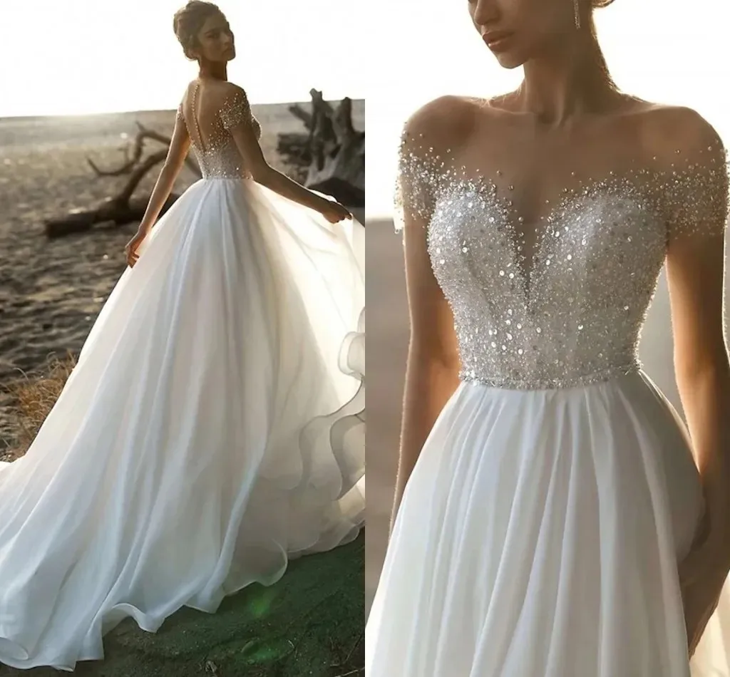 Short Sleeves Beach Wedding Dresses A Line White Long Bridal Gowns Beaded Sequins Chiffon Bohemian Robe De mariée
Short Sleeves Beach Wedding Dresses A Line White Long Bridal Gowns Beaded Sequins Chiffon Bohemian Robe De mariée