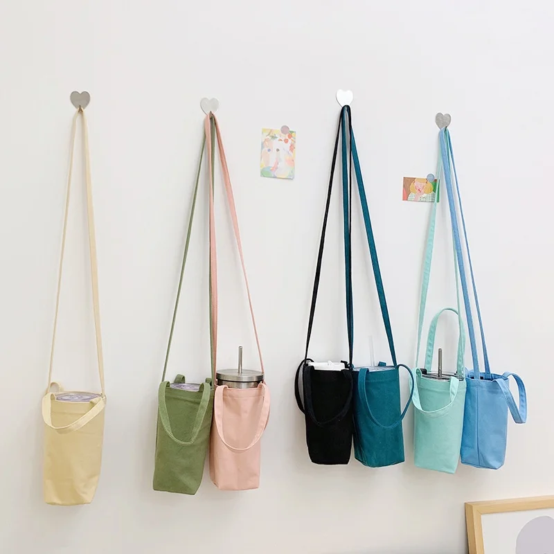SUGAW Water Bottle Storage Bag Tumbler Case Holder Bag Canvas Portable Mug Holder Sleeve Multifunctional Canvas Bagh
SUGAW Water Bottle Storage Bag Tumbler Case Holder Bag Canvas Portable Mug Holder Sleeve Multifunctional Canvas Bagh