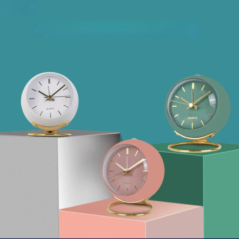 Nordic Creative Metal Alarm Clock Light Luxury Table Decor Luminous Bedside Silent Quartz Watch Students Wake Up Alarm Clocks 
Nordic Creative Metal Alarm Clock Light Luxury Table Decor Luminous Bedside Silent Quartz Watch Students Wake Up Alarm Clocks