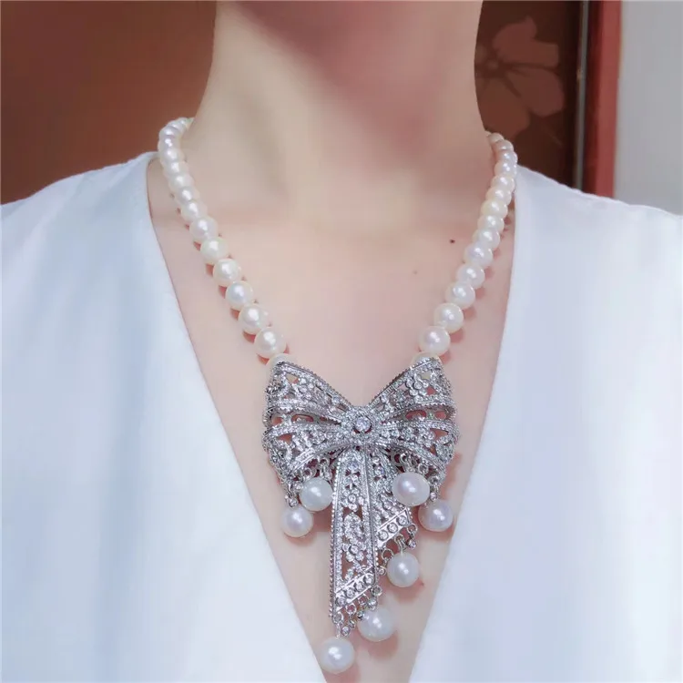 Hand knotted 9-10mm white natural freshwater pearl bowknot micro inlay zircon necklace fashion jewelry
Hand knotted 9-10mm white natural freshwater pearl bowknot micro inlay zircon necklace fashion jewelry