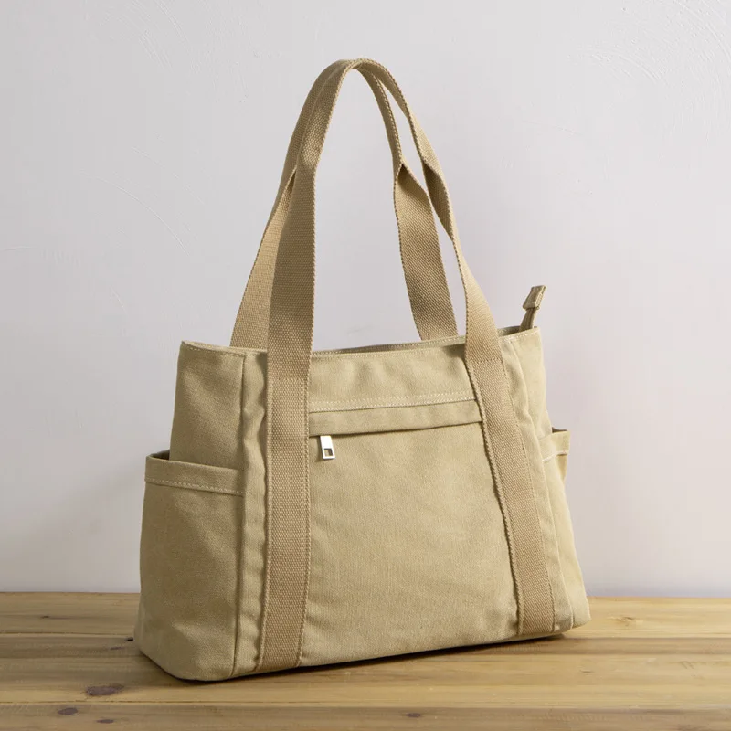 2023 new women's large capacity canvas travel portable casual fashion trend retro Tote bag solid color simple handbag traveling
2023 new women's large capacity canvas travel portable casual fashion trend retro Tote bag solid color simple handbag traveling