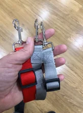 Suministros para mascotas para cinturón de seguridad de coche cinturón de silla para perro correa del cinturón del vehículo ajustable acolchado elástico reflectante de seguridad para perro gato