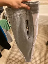 Pantalones de bolsillo de moda a rayas laterales para hombre, ropa de calle informal, jogging, Hip Hop, con cremallera, pitillo, para deportes al aire libre