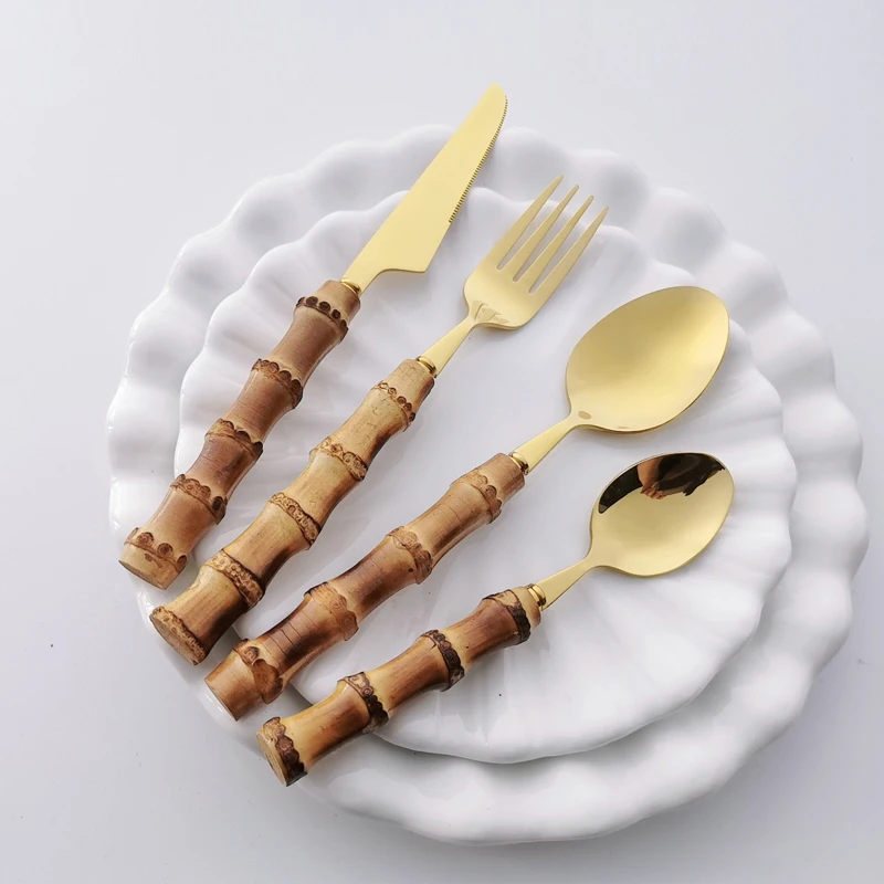 Набор золотых столовых приборов с бамбуковой ручкой, комплект из 16/32 предметов, из нержавеющей стали, нож, вилка, ложка, столовая посуда, кухонные принадлежности
Набор золотых столовых приборов с бамбуковой ручкой, комплект из 16/32 предметов, из нержавеющей стали, нож, вилка, ложка, столовая посуда, кухонные принадлежности