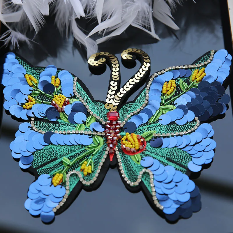 The new handmade nail-beads large sequin butterfly patch cloth decorated applique with the decoration of DIY accessories.
The new handmade nail-beads large sequin butterfly patch cloth decorated applique with the decoration of DIY accessories.