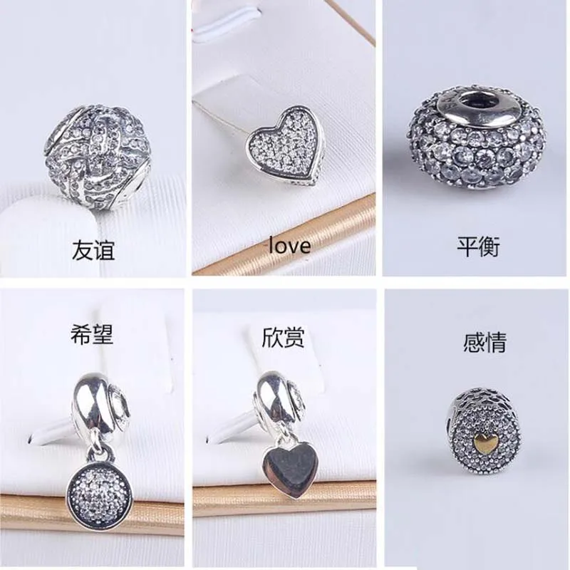 High Quality New Collection 925 Sterling Silver Small Charms Fitting Essence Bracelet
High Quality New Collection 925 Sterling Silver Small Charms Fitting Essence Bracelet
