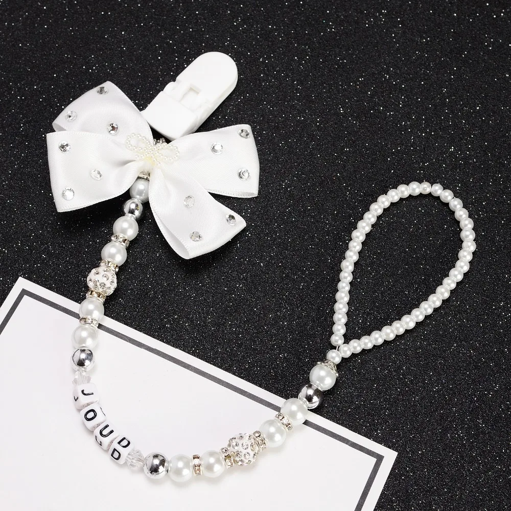 Personalised -Any name Bling silver rhinestone bow pink and sliver beads dummy clip holder pacifier clips holder/Teethers clip
Personalised -Any name Bling silver rhinestone bow pink and sliver beads dummy clip holder pacifier clips holder/Teethers clip