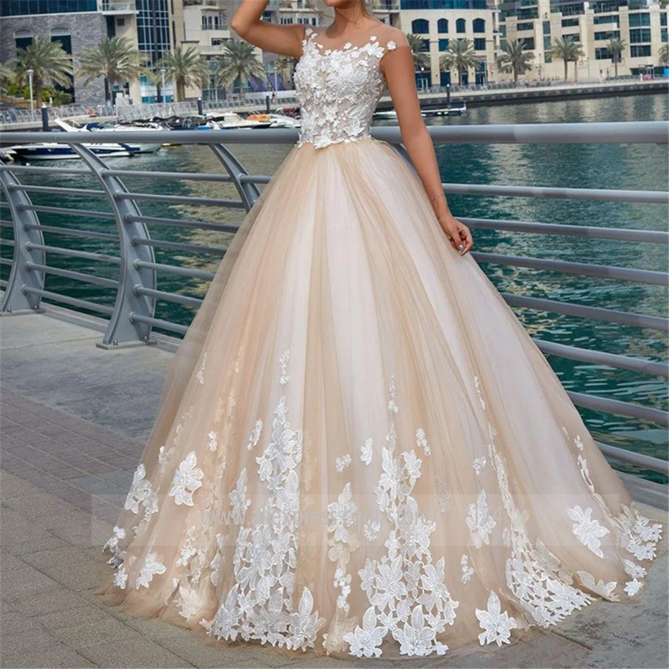 Sheer Tulle Neck Champagne Ball Gown Lace Applique Wedding Dress Princess Cap Sleeves Illusion Back Sweep Train Bridal Dress
Sheer Tulle Neck Champagne Ball Gown Lace Applique Wedding Dress Princess Cap Sleeves Illusion Back Sweep Train Bridal Dress