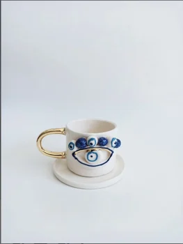 Handmade coarse pottery ceramic evil eye beaded coffee cup and saucer creative high quality teacup and base art 2020 trend
Handmade coarse pottery ceramic evil eye beaded coffee cup and saucer creative high quality teacup and base art 2020 trend