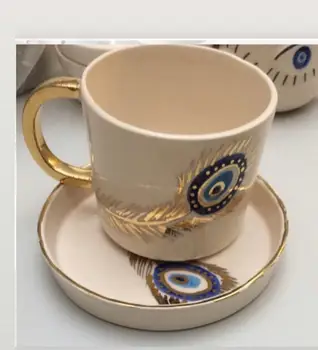 Handmade coarse pottery ceramic evil eye beaded coffee cup and saucer creative high quality teacup and base art 2020 trend
Handmade coarse pottery ceramic evil eye beaded coffee cup and saucer creative high quality teacup and base art 2020 trend