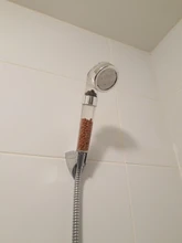 Cabezal de ducha de mano con bolas de cerámica activada de iones negativos, chorro de piedra de alta presión, envío directo