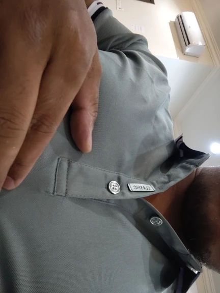 Urban Chic Men's Polo Shirt: Sleek Grey with Classic Striped Trim Detail photo review