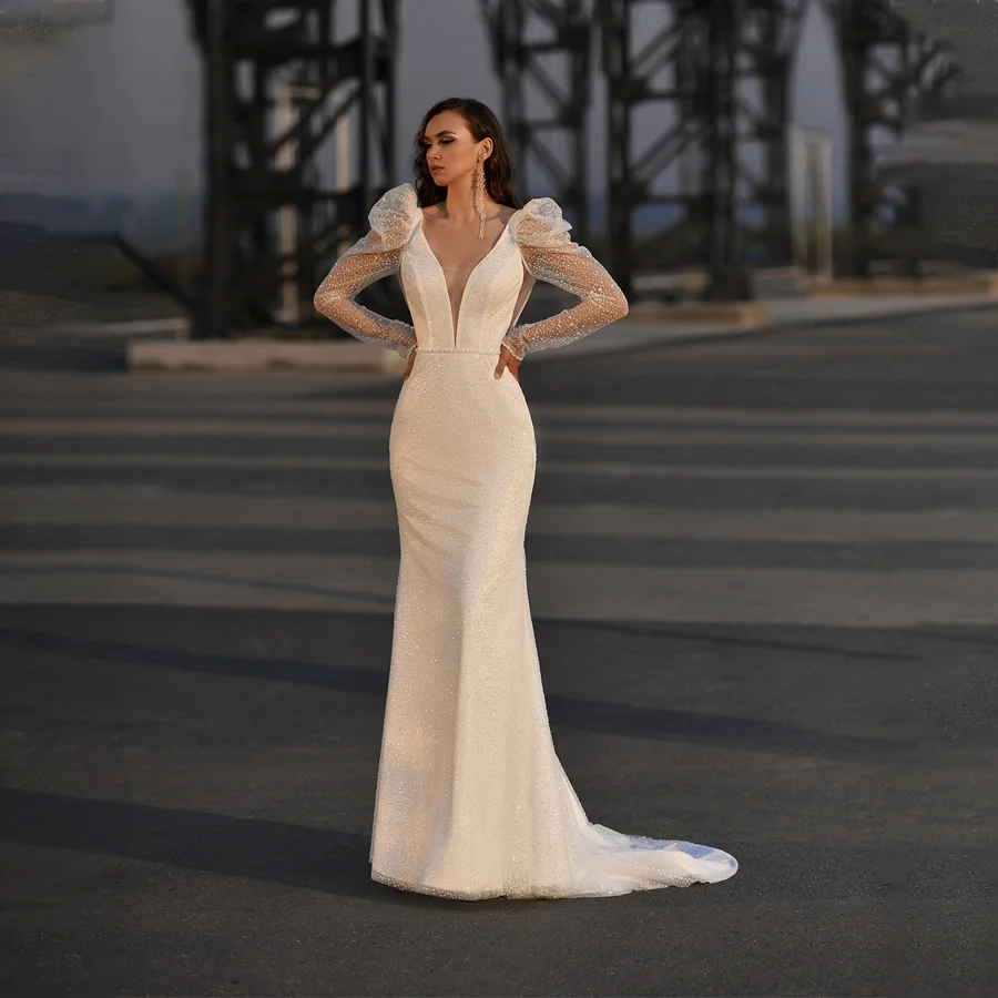

Sparkling Sequin Mermaid Wedding Dress with Illusion Long Sleeves Shiny Bridal Gown with Daring V-neckline And Watteau Train