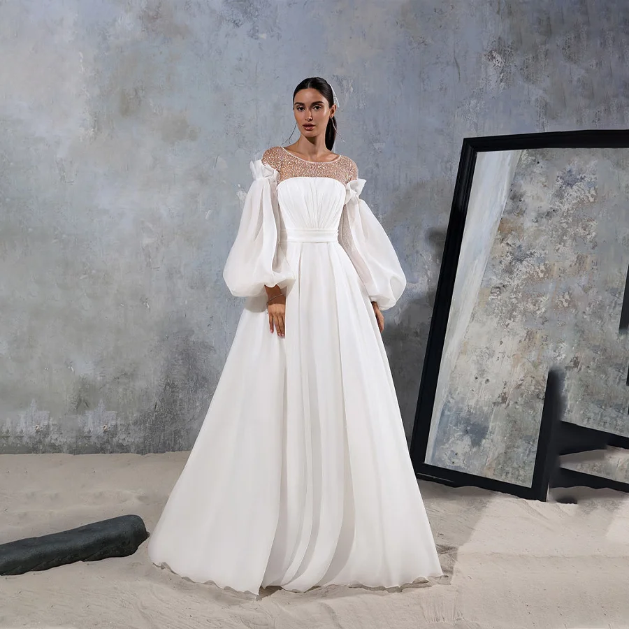 

Charming Pleated Wedding Dress Features Shiny Sequin Neckline Opulent A-line Bridal Gown with Long Puffy Sleeves And Court Train