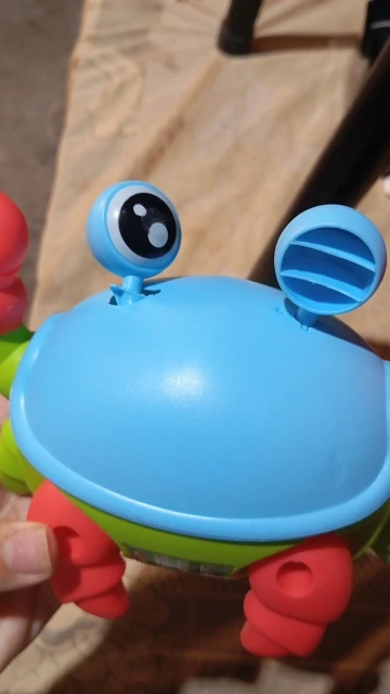 Brinquedo Caranguejo Fujão Musical Som Luz E Movimento photo review