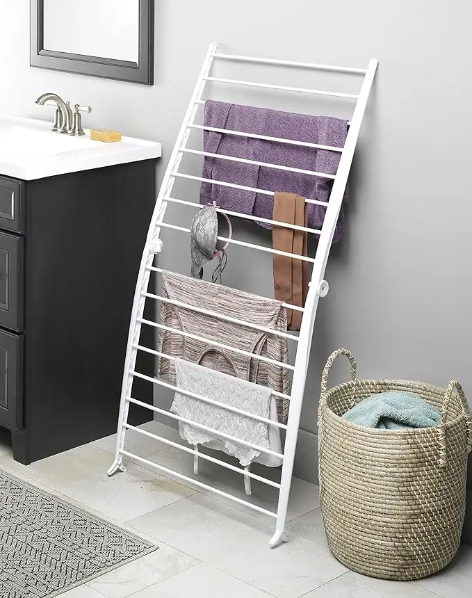 Compact white drying rack, 6"L x 26"W x 51.5"H. Freestanding and foldable for space-saving indoor use. 3