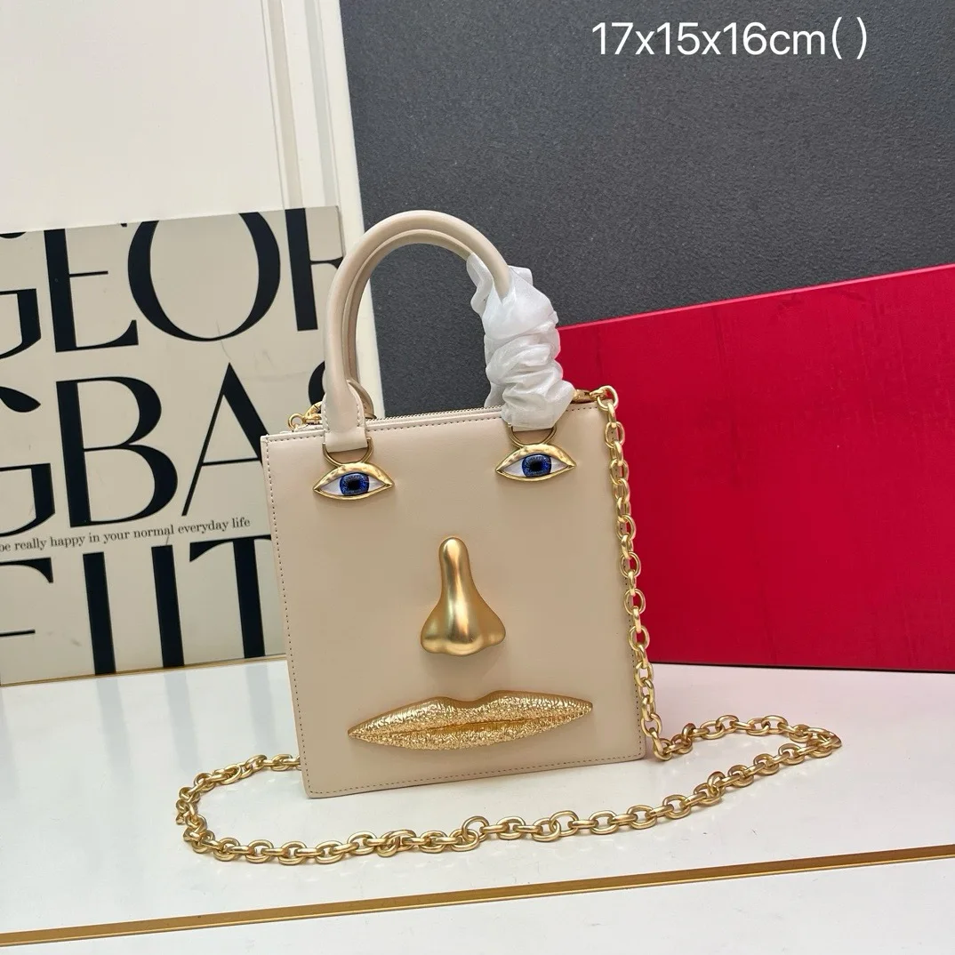 Mini sac en forme de visage pour femme, cuir noir de haute qualité, sac à main de marque de luxe, bijoux, motif œil, bandoulière en métal doré, sac bandoulière 1 Mini sac en forme de visage pour femme, cuir noir de haute qualité, sac à main de marque de luxe, bijoux, motif œil, bandoulière en métal doré, sac bandoulière 1
