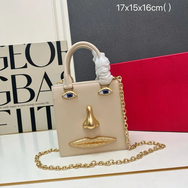 Mini sac en forme de visage pour femme, cuir noir de haute qualité, sac à main de marque de luxe, bijoux, motif œil, bandoulière en métal doré, sac bandoulière 1