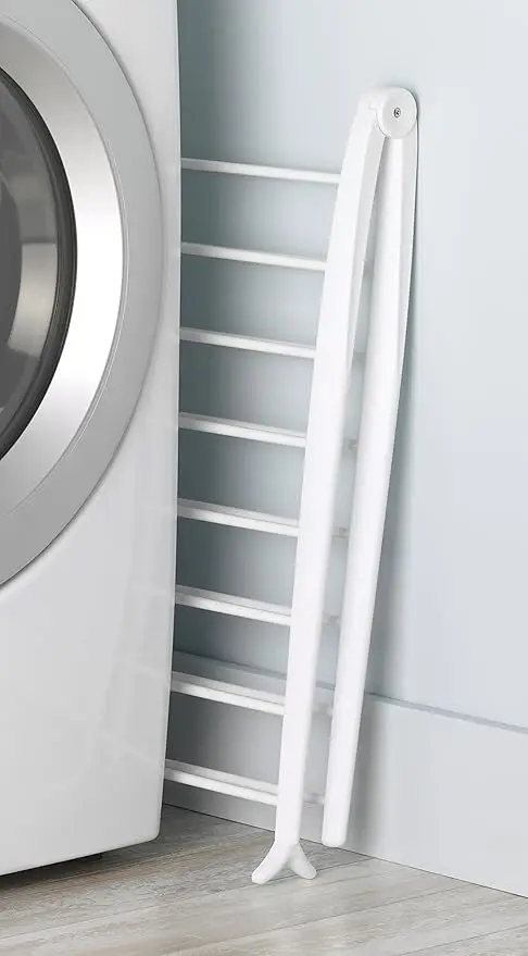 Compact white drying rack, 6"L x 26"W x 51.5"H. Freestanding and foldable for space-saving indoor use. 5