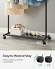 Clothes Rack with Wheels, Black Finish, Includes Storage Shelf, 110 LBS Capacity, Ideal for Hanging Clothes or Garment Storage. 4