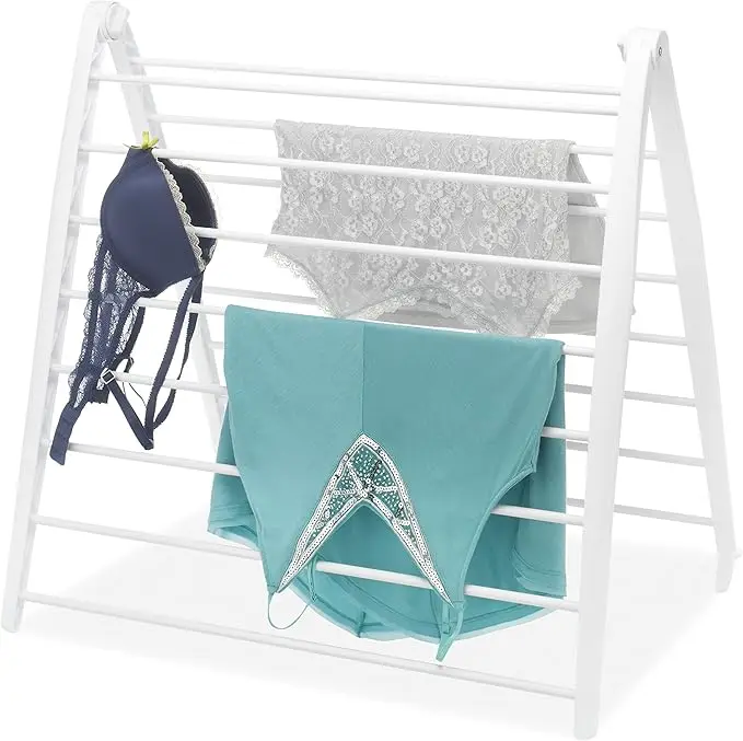 Compact white drying rack, 6"L x 26"W x 51.5"H. Freestanding and foldable for space-saving indoor use. 6