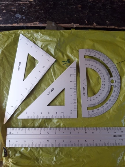 DELI Juego de dibujo de aluminio Juego de reglas de 4 piezas para la escuela Regla recta Transportador triangular Papelería photo review