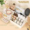 Multi-drawer makeup organizer. White plastic design for brushes and cosmetics. Fits countertops or vanities. 4
