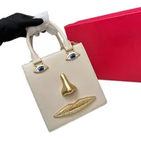Mini sac en forme de visage pour femme, cuir noir de haute qualité, sac à main de marque de luxe, bijoux, motif œil, bandoulière en métal doré, sac bandoulière 5