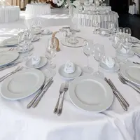 6-Pack White Round Tablecloths, 120 Inches Diameter, Stain Resistant, Polyester, Ideal for Weddings or Parties. 2