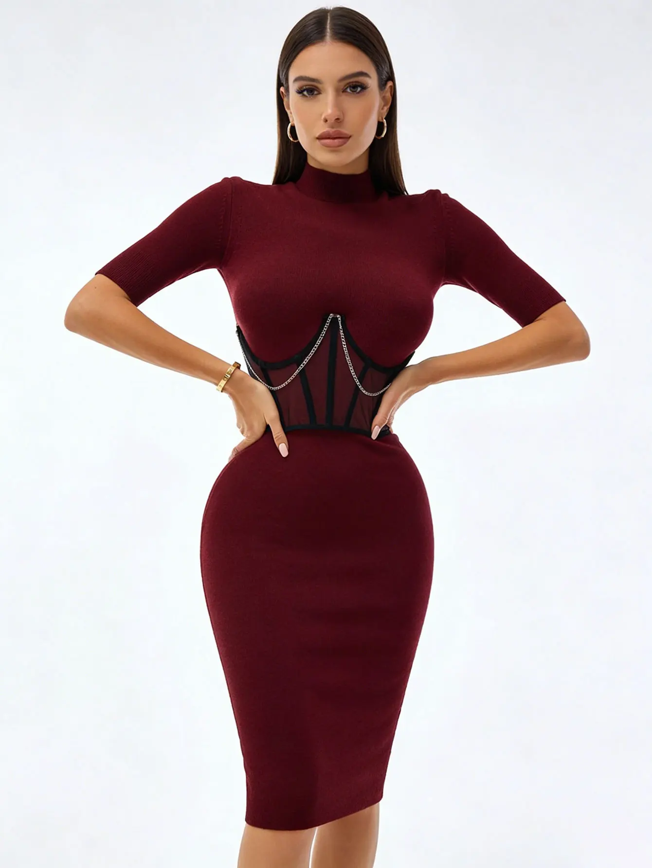Waist-defining fashion piece worn over fitted knitwear
