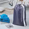 2-pack XL nylon laundry bags with straps. Holds up to 4 loads of clothes. Fits hampers or baskets. Durable grey design. 2