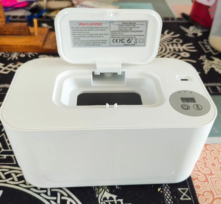 Aquecedor de toalhetes para bebés - foto de análise