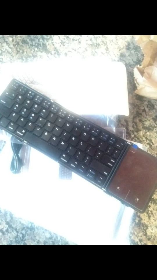 Mini teclado dobrável Avatto sem fio bluetooth com touchpad photo review