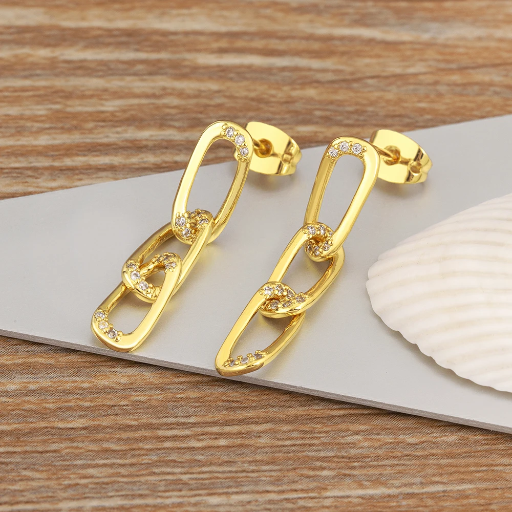 Nidin boucles oreilles chaine cuivre zircon 2026