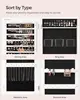 Wall-mounted jewelry armoire with mirror. Includes 2 trays, lockable white design. 5