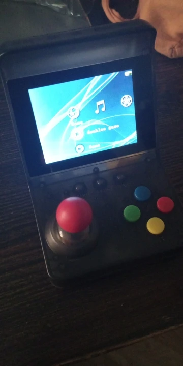 Console Portable Rétro 32 Bits - 520 Jeux - Mini Arcade Portable photo review