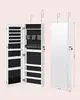 Wall-mounted jewelry armoire with mirror. Includes 2 trays, lockable white design. 6