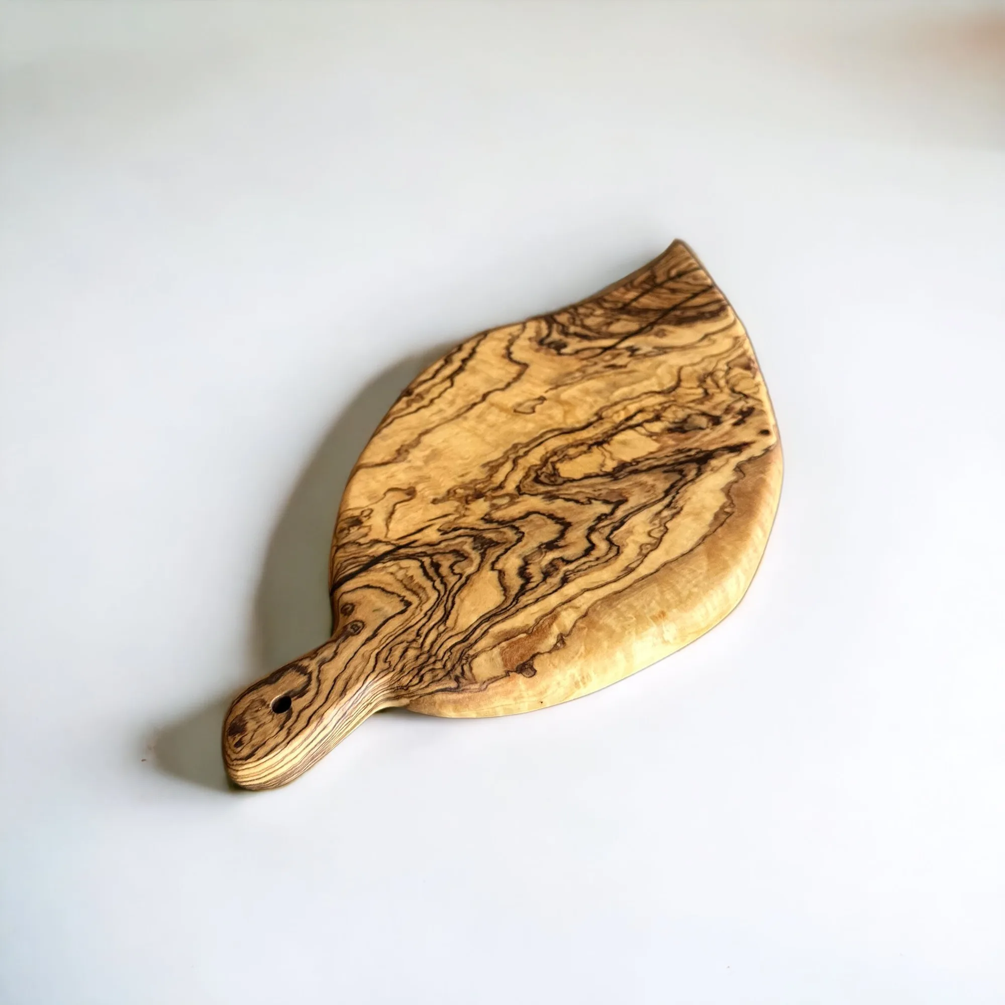 

Leaf-Shaped Olive Wood Cutting Board - Natural Elegance for Culinary Artistry
