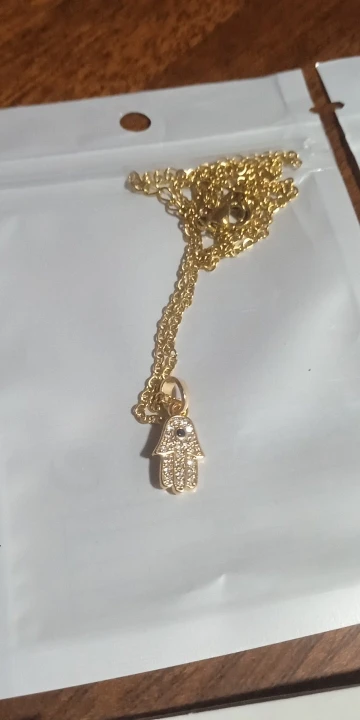 Elevate Your Look: Hollow Knight Necklace with Gold Glamour photo review