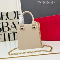 Mini sac en forme de visage pour femme, cuir noir de haute qualité, sac à main de marque de luxe, bijoux, motif œil, bandoulière en métal doré, sac bandoulière 2