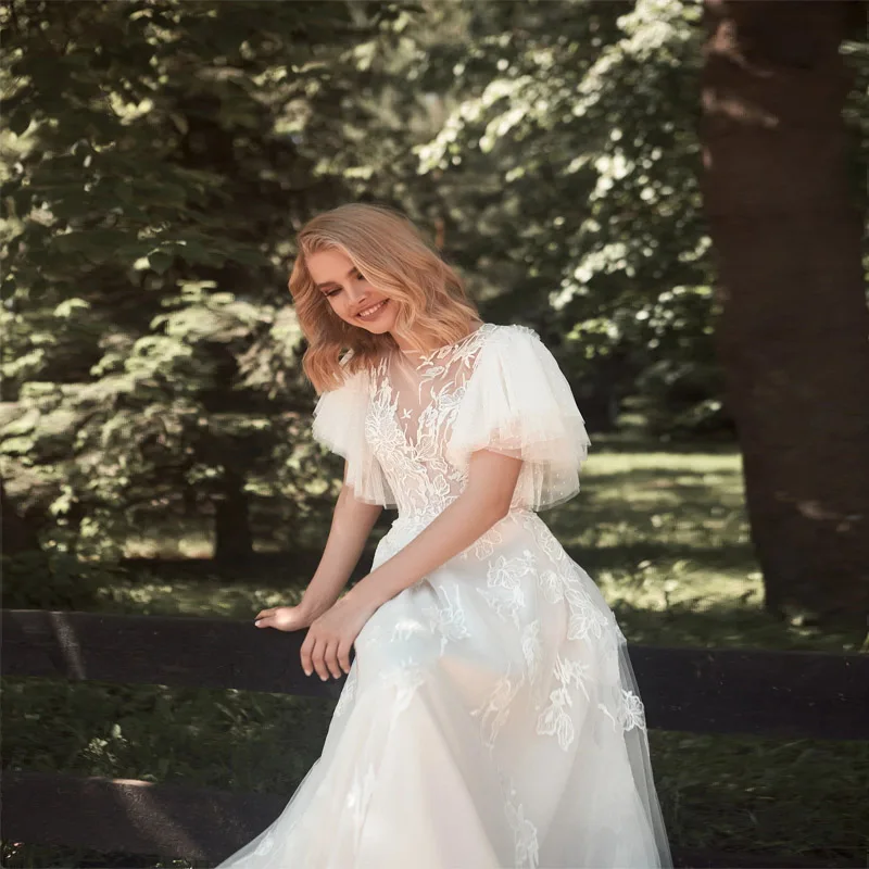 

PERFECT 2023 Butterfly Sleeve A-Line Chic Wedding Dress Tulle O Neck Appliques Flowers Button Back Chapel Train Custom Made