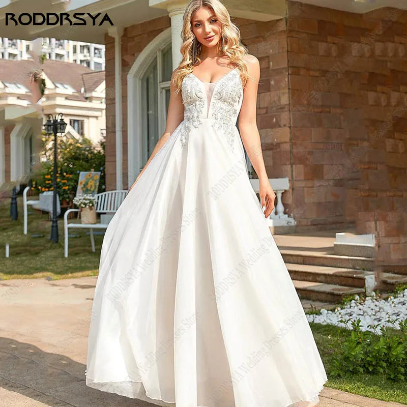 

RODDRSYA Beach Tulle Wedding Dress Spaghetti Straps Sequins Bridal Gowns Vestido De Noiva A-line Backless Appliques Bride Party
