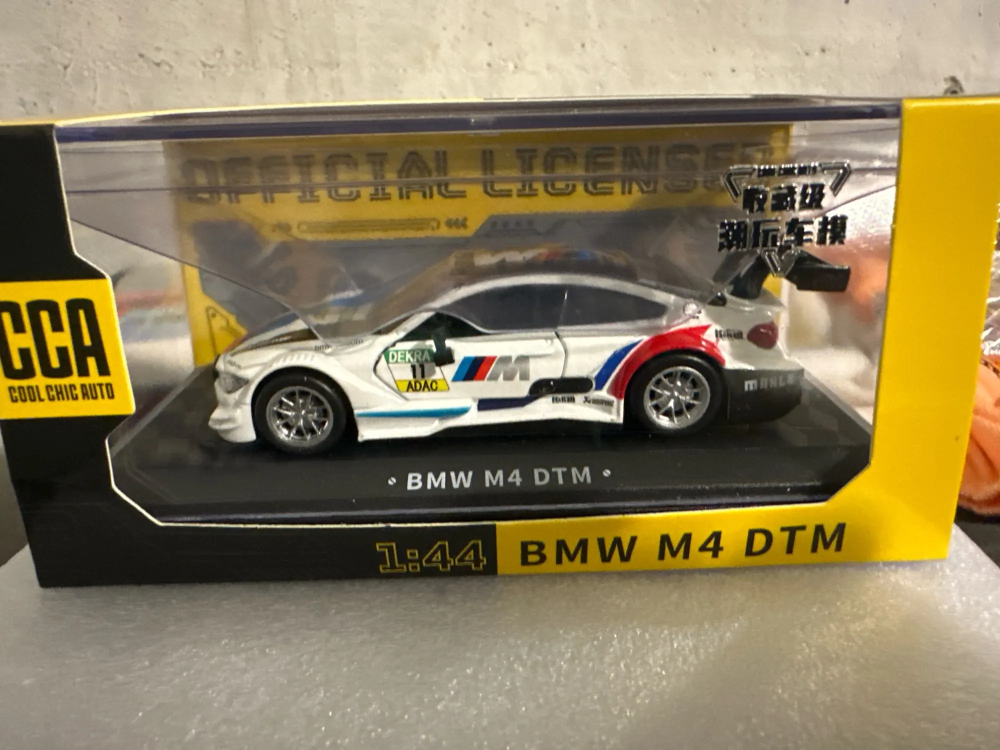 CCA MSZ 1:43 BMW M4 DTM Lamborghini Maserati McLaren Land Rover Guard Benz Car Model With Helmet Acrylic Box Alloy Car Toy photo review